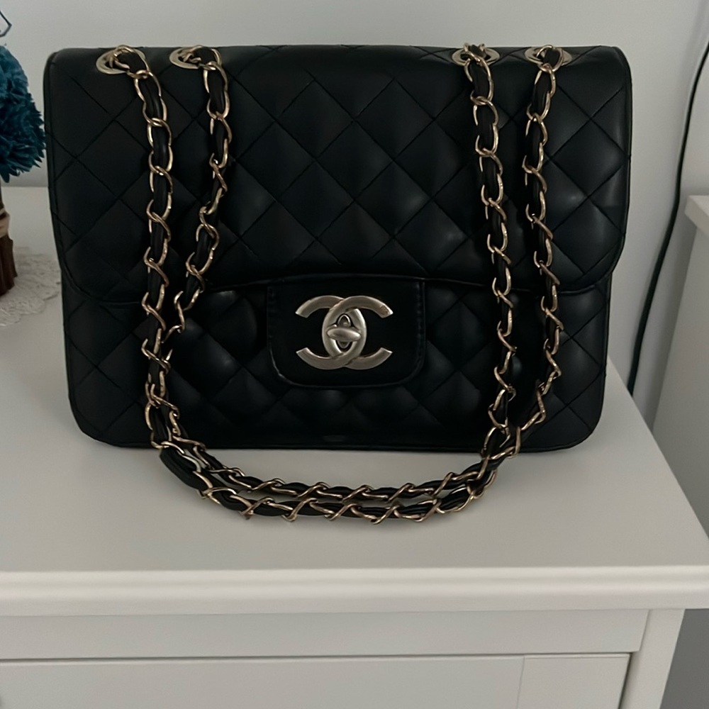 Chanel crossbody bag with real cow leather and has white gold hardware!